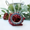 Oval Cut Sapphire Halo Silver Pendant