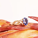 Oval Tanzanite Ring With Diamond Half Infinity Twist Shoulders in Rose Gold