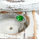 Tsavorite and diamond halo white gold ring