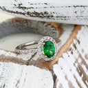 Tsavorite and diamond halo white gold ring