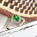 Tsavorite and diamond halo white gold ring