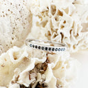 Petite Four Claw Channel Set Black Diamond White Gold Ring