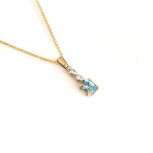 Petite Oval Cut Blue Topaz and Diamond Pendant