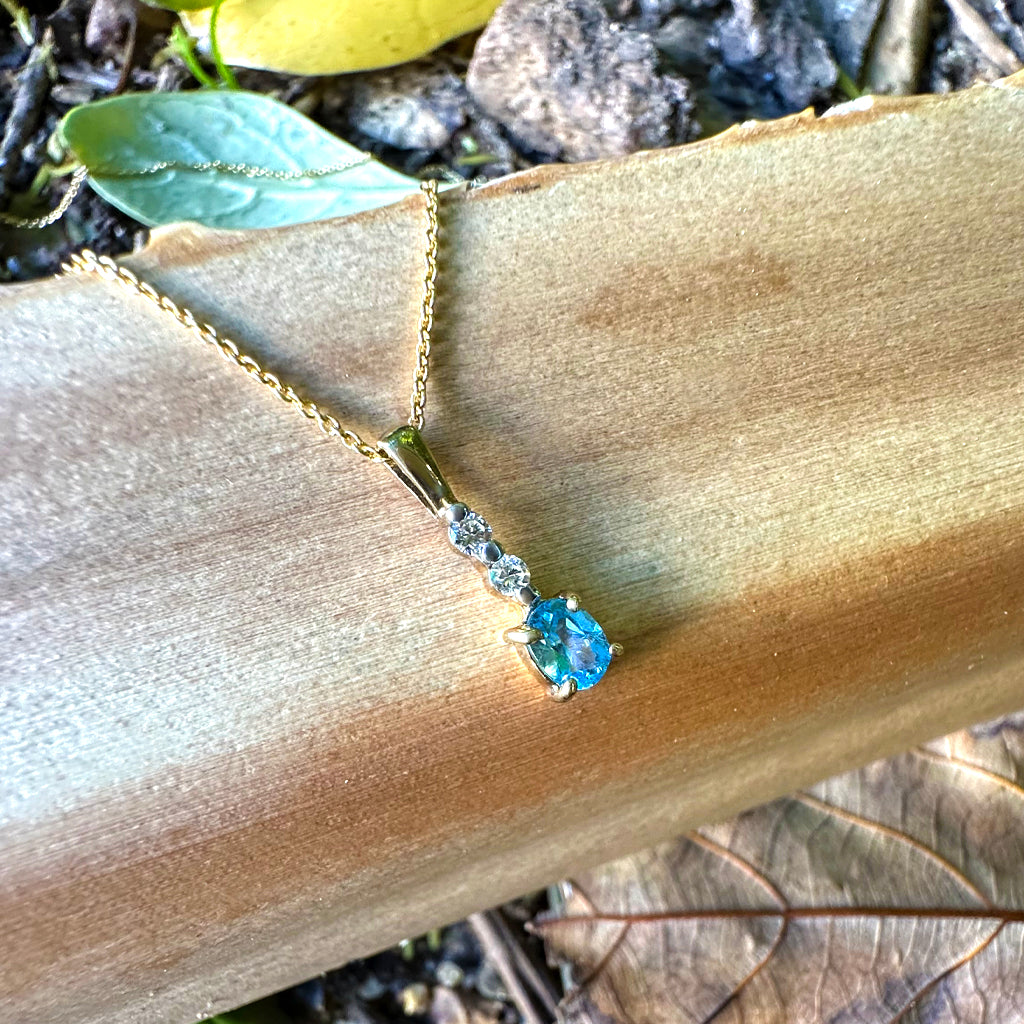 Petite Oval Cut Blue Topaz and Diamond Pendant