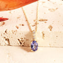 Petite Oval Tanzanite Yellow Gold Pendant with White Diamond Bale Highlight