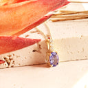 Petite Oval Tanzanite Yellow Gold Pendant with White Diamond Bale Highlight