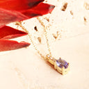 Petite Oval Tanzanite Yellow Gold Pendant with White Diamond Bale Highlight