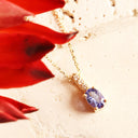 Petite Oval Tanzanite Yellow Gold Pendant with White Diamond Bale Highlight