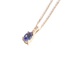 Petite Oval Tanzanite Yellow Gold Pendant with White Diamond Bale Highlight