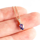 Petite Oval Tanzanite Yellow Gold Pendant with White Diamond Bale Highlight