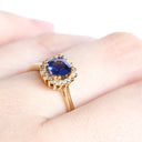 Poised Cushion Cut Sapphire And Diamond Halo Yellow Gold Ring