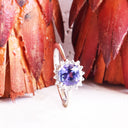 Poised Cushion Cut Tanzanite And Diamond Halo White Gold Ring