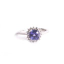 Poised Cushion Cut Tanzanite And Diamond Halo White Gold Ring