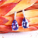 Prestigious Pear Cut Tanzanite And Delightful Diamond Highlight White Gold Earrings