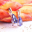 Prestigious Pear Cut Tanzanite And Delightful Diamond Highlight White Gold Earrings