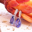 Prestigious Pear Cut Tanzanite And Delightful Diamond Highlight White Gold Earrings