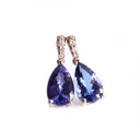 Prestigious Pear Cut Tanzanite And Delightful Diamond Highlight White Gold Earrings