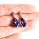 Prestigious Pear Cut Tanzanite And Delightful Diamond Highlight White Gold Earrings