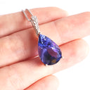 Prestigious Pear Cut Tanzanite And Delightful Diamond Highlight White Gold Pendant