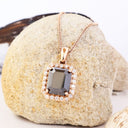 Radiant Emerald Cut Black Diamond With White Diamond Halo Rose Gold Pendant