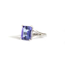 Regal Elevated Emerald Cut Tanzanite Solitaire White Gold Ring