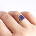 Regal Elevated Emerald Cut Tanzanite Solitaire White Gold Ring