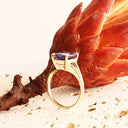 Regal Elevated Emerald Cut Tanzanite Solitaire Yellow Gold Ring