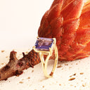 Regal Elevated Emerald Cut Tanzanite Solitaire Yellow Gold Ring