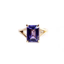 Regal Elevated Emerald Cut Tanzanite Solitaire Yellow Gold Ring