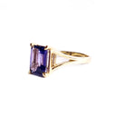 Regal Elevated Emerald Cut Tanzanite Solitaire Yellow Gold Ring