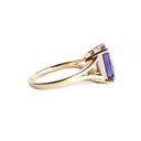Regal Elevated Emerald Cut Tanzanite Solitaire Yellow Gold Ring