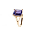 Regal Elevated Emerald Cut Tanzanite Solitaire Yellow Gold Ring