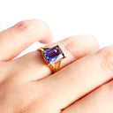 Regal Elevated Emerald Cut Tanzanite Solitaire Yellow Gold Ring