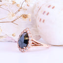 Rose Cut Pear Shaped Black Diamond Ring With White Diamond Halo in Rose Gold