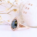 Rose Cut Pear Shaped Black Diamond Ring With White Diamond Halo in Rose Gold