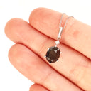 Stylish Six Claw Oval Cut Black Diamond With White Diamond Highlight White Gold Pendant