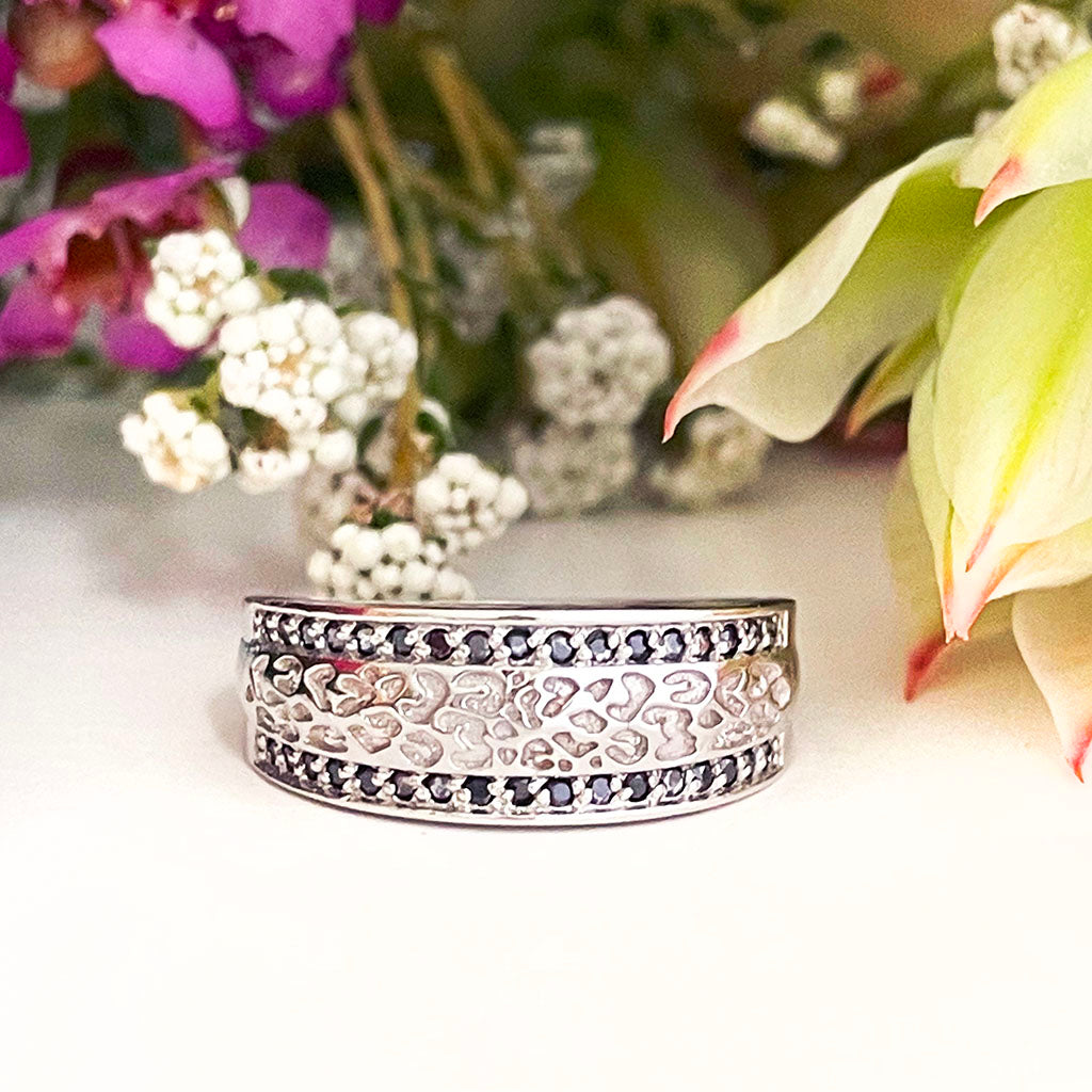 Silver paw track black diamond ring