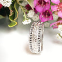 Silver paw track black diamond ring