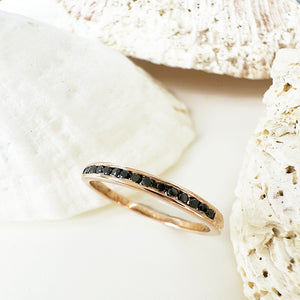 Sleek Channel Set Black Diamond Rose Gold Ring