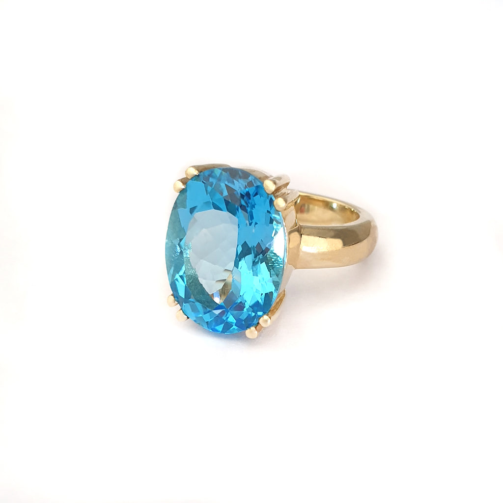 Solid Solitaire Deep Blue Topaz Oval Cut Double Claw Ring