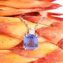 Stunning Cushion Cut Double Claw Tanzanite And Diamond Accent White Gold Pendant