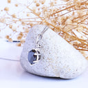 Stylish Six Claw Oval Cut Black Diamond With White Diamond Highlight White Gold Pendant