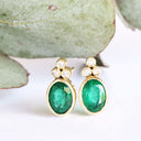 Sublime Bezel Set Oval Cut Emerald and Trilogy Diamond Earrings In Yellow Gold