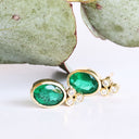 Sublime Bezel Set Oval Cut Emerald and Trilogy Diamond Earrings In Yellow Gold