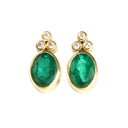Sublime Bezel Set Oval Cut Emerald and Trilogy Diamond Earrings In Yellow Gold