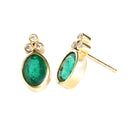 Sublime Bezel Set Oval Cut Emerald and Trilogy Diamond Earrings In Yellow Gold