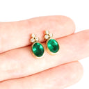 Sublime Bezel Set Oval Cut Emerald and Trilogy Diamond Earrings In Yellow Gold