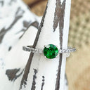 Tsavorite and diamond band ring