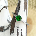 Tsavorite and diamond band ring