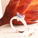 Sumptuous Diamond Point Trilliant Cut Tanzanite Diamond Highlight White Gold Ring